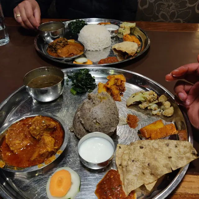 A Thakali set served family style